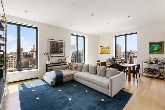 Living room at 21 East 12th Street, Unit 17B with downtown views.