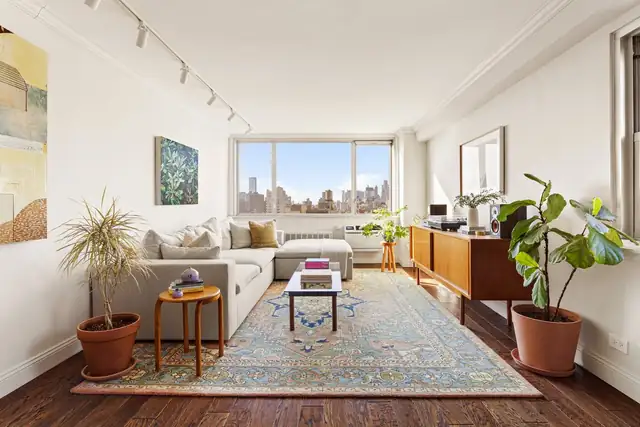 Corner living room at 333 East 14th Street, Unit 14KLM.