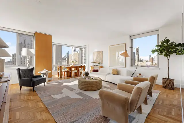 Bright corner living room at 524 East 72nd Street, Unit 28DE.